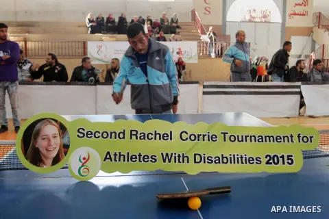 Disabled Palestinians play table tennis during the second Rachel Corrie Championship in Khan Younis in the southern Gaza strip on Dec. 30, 2015. Corrie, an American activist for the International Solidarity Movement (ISM...