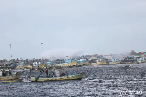 A Picture shows waves crash fishermen's harbor at the beach of Gaza city on the first day of the new year on Jan. 01, 2016. Photo by Mohammed Asad
