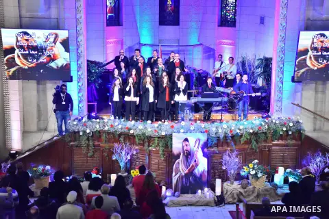 Egyptian Christians take part in a prayer during celebrations of Christmas and New Year festivities, at Kasr el-Dobara evangelical Church, in Cairo on Jan 01, 2016. Photo by Amr Sayed