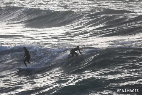 Palestinian youth enjoy water skiing in the Mediterranean Sea in Gaza City on January 10, 2016. Photo by Mohammed Asad