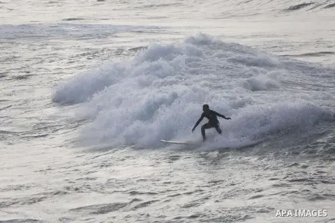 Palestinian youth enjoy water skiing in the Mediterranean Sea in Gaza City on January 10, 2016. Photo by Mohammed Asad