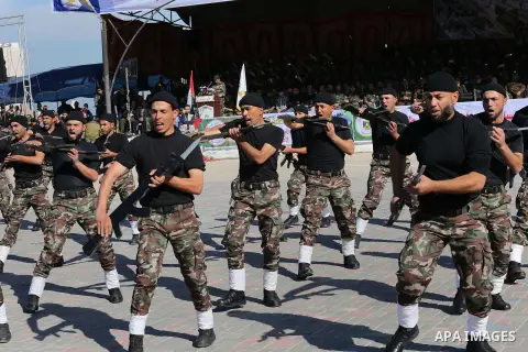 Members of Palestinian security forces loyal to Hamas demonstrate their skills during a military graduation ceremony in Gaza City January 10, 2016. Photo by Mohammed Asad