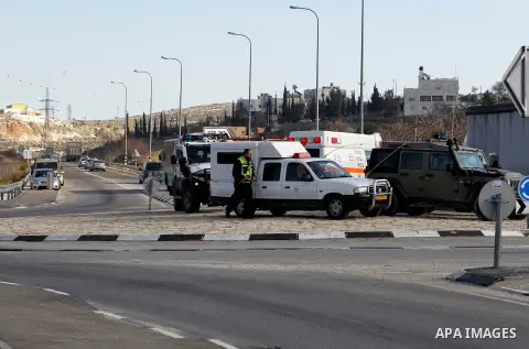 Israeli soldiers stand guard near the scene where two Palestinian men were shot dead by Israeli troops at the Beit Ainun junction northeast of Hebron in the occupied West Bank on Jan. 12, 2016. An Israeli army spokespers...