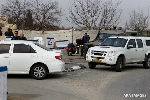 Israeli forensic policemen gather evidence at the site of a stabbing attack at the Beit Ainun junction near Hebron on January 14, 2016. Israeli forces Thursday shot and killed a Palestinian near the Beit Ainun junction n...