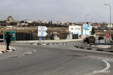 A female Israeli soldier stands guard near the scene of a stabbing attack at the Beit Ainun junction near Hebron on January 14, 2016. Israeli forces Thursday shot and killed a Palestinian near the Beit Ainun junction nor...