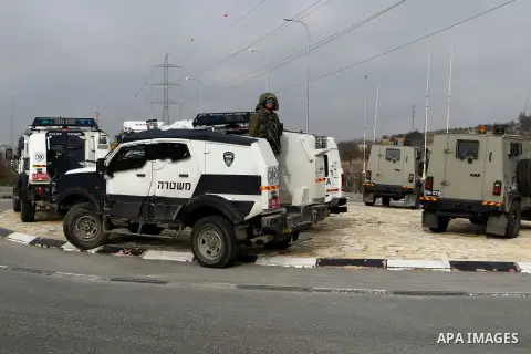 Israeli soldiers stand guard near the scene of a stabbing attack at the Beit Ainun junction near Hebron on January 14, 2016. Israeli forces Thursday shot and killed a Palestinian near the Beit Ainun junction northeast of...