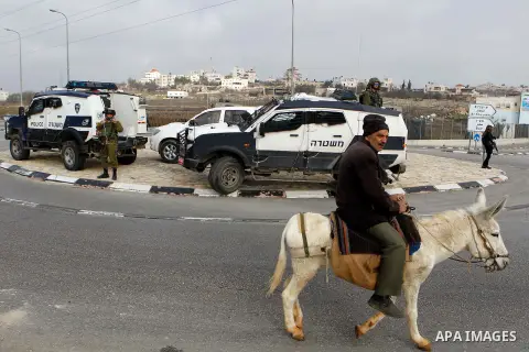 Israeli soldiers stand guard near the scene of a stabbing attack at the Beit Ainun junction near Hebron on January 14, 2016. Israeli forces Thursday shot and killed a Palestinian near the Beit Ainun junction northeast of...