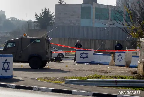 Israeli soldiers stand guard near the scene of a stabbing attack at the Beit Ainun junction near Hebron on January 14, 2016. Israeli forces Thursday shot and killed a Palestinian near the Beit Ainun junction northeast of...