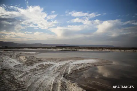 A general veiw show the salt extraction "raw material" from the Dead Sea, in the West Bank city of Jericho on January 14, 2016. The Dead Sea also called the Salt Sea, is a salt lake with borders to Jordan in the east and...