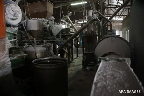 A Palestinian worker extracts salt from the Dead Sea, at his factory, in the West Bank city of Jericho on January 14, 2016. The Dead Sea also called the Salt Sea, is a salt lake with borders to Jordan in the east and the...