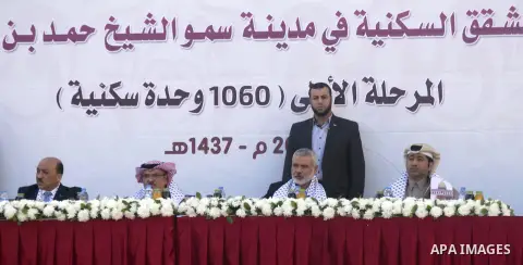 Palestinians gather at the Qatari-funded Hamad City housing complex in Khan Younis, southern Gaza Strip, Saturday, Jan. 16, 2016. More than 1,000 Palestinian families have taken possession of new apartments in the first...