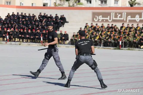 Palestinian members of officers display their skills during a graduation ceremony, in Gaza city on January 17, 2016. Photo by Mohammed Asad