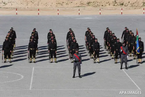Palestinian members of officers display their skills during a graduation ceremony, in Gaza city on January 17, 2016. Photo by Mohammed Asad