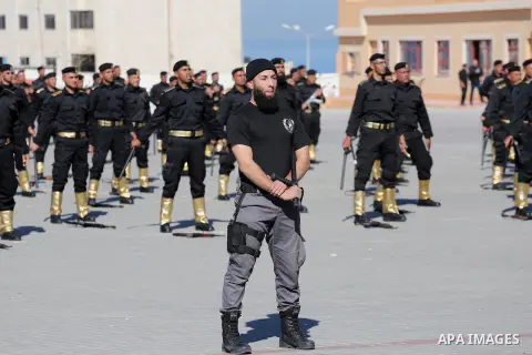 Palestinian members of officers display their skills during a graduation ceremony, in Gaza city on January 17, 2016. Photo by Mohammed Asad