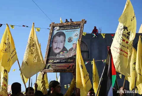 Palestinian Fatah supporters celebrate during a rally as they mark the 51st anniversary of the founding of the Fatah movement, in Beit Lahia in the northern Gaza Strip, on Jan. 17, 2016. Photo by Nidal Alwaheidi