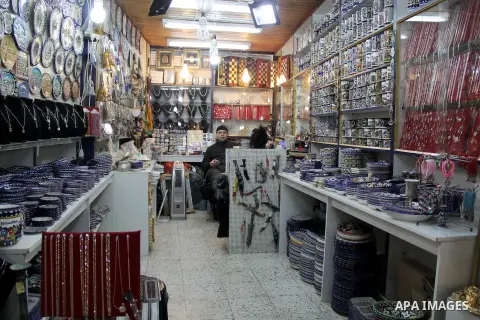 A Palestinian vendor displays goods at market in Jerusalem's old city on Jan. 18, 2016. Photo by Mahfouz Abu Turk