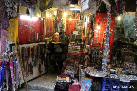 A Palestinian vendor displays goods at market in Jerusalem's old city on Jan. 18, 2016. Photo by Mahfouz Abu Turk