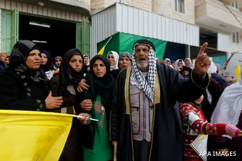 Palestinians carry the body of Ruqya Abu Eid, 13, during her funeral, who Israeli military said was shot dead by Israeli soldiers after he tried to stab a soldier, in the West Bank city of Hebron, on January, 24, 2016. P...