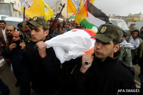 Palestinians carry the body of Ruqya Abu Eid, 13, during her funeral, who Israeli military said was shot dead by Israeli soldiers after he tried to stab a soldier, in the West Bank city of Hebron, on January, 24, 2016. P...