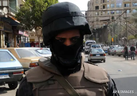 A member of the Egyptian police special forces stands guard on Cairo's landmark Tahrir Square on January 25, 2016, as the country marks the fifth anniversary of the 2011 uprising. Egyptians marked the fifth anniversary o...
