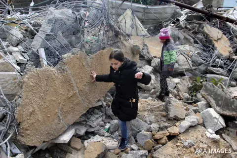Palestinians look at the rubble of their house that was demolished by Israeli bulldozerst, in the Arab east Jerusalem neighbourhood of Shuafat on January 27, 2016. Palestinian homes built without an Israeli construction...