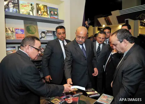 Egyptian Prime Minister Sherif Ismail opens the Cairo International Book Fair, in Cairo, Egypt, on Jan. 27, 2016. Photo by Stranger