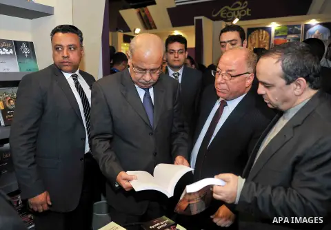 Egyptian Prime Minister Sherif Ismail opens the Cairo International Book Fair, in Cairo, Egypt, on Jan. 27, 2016. Photo by Stranger