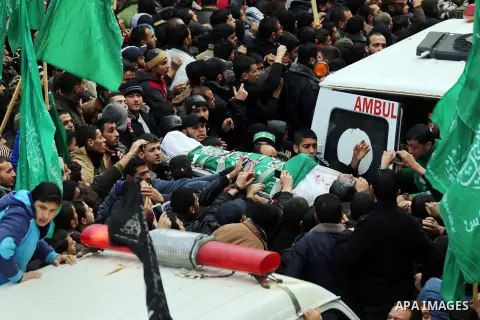 Palestinians carry the body of one of the seven Hamas militants who were killed after a tunnel built for fighting Israel collapsed in the Gaza Strip, during their funeral in Gaza City on January 29, 2016. The Ezzedine Al...