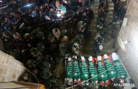 Palestinians pray in front of the bodies of seven Hamas militants who were killed after a tunnel built for fighting Israel collapsed in the Gaza Strip, during their funeral in Gaza City on January 29, 2016. The Ezzedine...