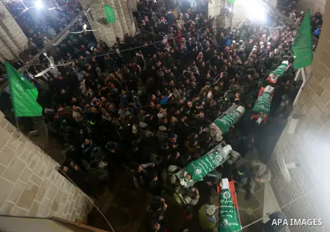 Palestinian Hamas militants carry the body of five of the seven Hamas militants who were killed after a tunnel built for fighting Israel collapsed in the Gaza Strip, during their funeral in Gaza City on January 29, 2016....