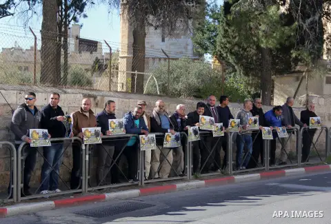 Palestinians take part during a protest to show solidarity with Palestinian children prisoner at Israeli jails outside an Israeli court in Jerusalem on January 31, 2016. Photo by Mahfouz Abu Turk