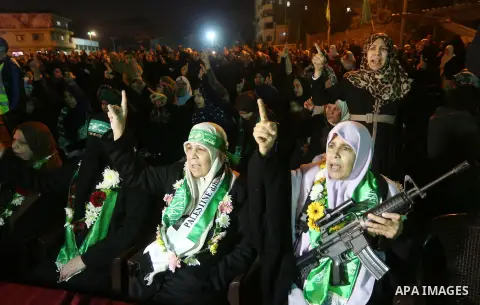 Palestinians supporting Hamas movement take part during a gathering to pay tribute to the brigade's militants who died after a tunnel collapsed in the Gaza Strip on January 31, 2016 in Gaza city. Seven Hamas militants we...