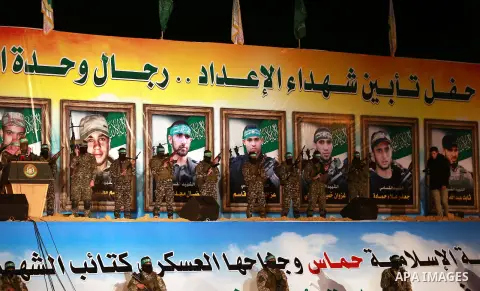 Spokesman of al-Qassam Brigades, the military wing of Hamas movement, Abu Obeida speaks during a gathering to pay tribute to the brigade's militants who died after a tunnel collapsed in the Gaza Strip on January 31, 2016...