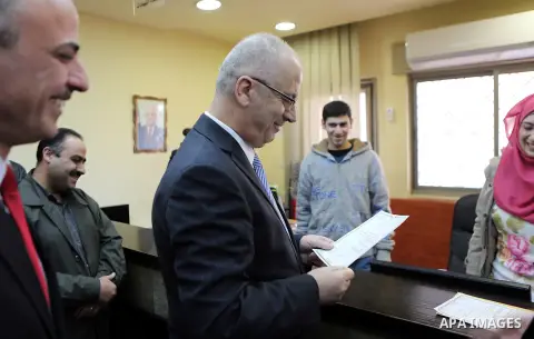 Palestinian Prime Minister Rami Hamdallah visits the headquarter of ministry of Justice in the West Bank city of Ramallah on Feb. 01, 2016. Photo by Prime Minister Office