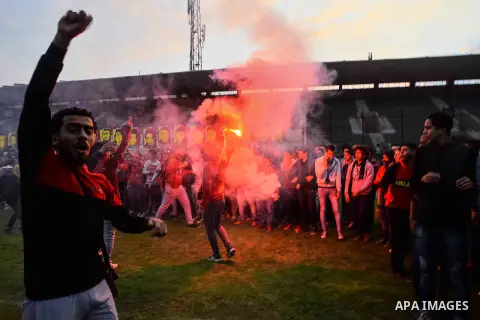 Al Ahly fans, also known as "Ultras", light flares and shout slogans at al-Ahly club's training stadium marking the fourt anniversary of killing al-Ahly fans in what known as the "Port Said massacre", on February 1, 2016...