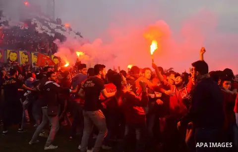 Al Ahly fans, also known as "Ultras", light flares and shout slogans at al-Ahly club's training stadium marking the fourt anniversary of killing al-Ahly fans in what known as the "Port Said massacre", on February 1, 2016...