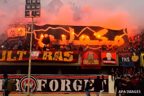 Al Ahly fans, also known as "Ultras", light flares and shout slogans at al-Ahly club's training stadium marking the fourt anniversary of killing al-Ahly fans in what known as the "Port Said massacre", on February 1, 2016...