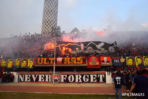 Al Ahly fans, also known as "Ultras", light flares and shout slogans at al-Ahly club's training stadium marking the fourt anniversary of killing al-Ahly fans in what known as the "Port Said massacre", on February 1, 2016...