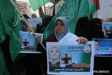 Palestinian women hold banners during a protest to show solidarity with journalist Mohammed al-Qiq who is imprisoned in an Israeli jail, Gaza city, on February 02, 2016. Photo by Mohammed Asad