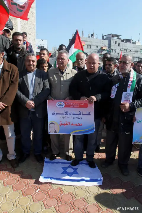 Palestinians take part in a protest to show solidarity with journalist Mohammed al-Qiq who is imprisoned in an Israeli jail in rafah in the southern Gaza strip, on Feb. 03, 2016. Photo by Abed Rahim Khatib