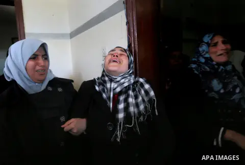 Relatives of Palestinian Hamas militant Ahmed al-Zahar, who was killed when a tunnel collapse on Tuesday, mourn during his funeral in the village of Al-Moghraga near central Gaza Strip, February 3, 2016. The collapse of...