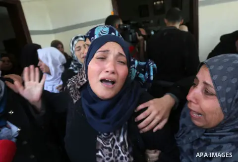 Relatives of Palestinian Hamas militant Ahmed al-Zahar, who was killed when a tunnel collapse on Tuesday, mourn during his funeral in the village of Al-Moghraga near central Gaza Strip, February 3, 2016. The collapse of...