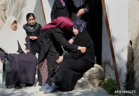 Relatives of Palestinian Hamas militant Ahmed al-Zahar, who was killed when a tunnel collapse on Tuesday, mourn during his funeral in the village of Al-Moghraga near central Gaza Strip, February 3, 2016. The collapse of...