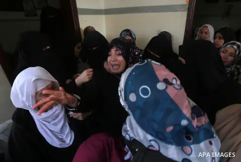 Relatives of Palestinian Hamas militant Ahmed al-Zahar, who was killed when a tunnel collapse on Tuesday, mourn during his funeral in the village of Al-Moghraga near central Gaza Strip, February 3, 2016. The collapse of...