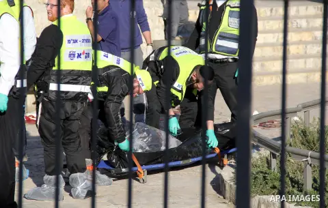 Ultra-Orthodox Jewish Zaka volunteers carry the bodies of two of the reported Palestinian assailants who were killed following an attack at Damascus Gate, a main entrance to Jerusalem's Old City on February 3, 2016. Thre...