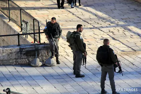 Israeli border policemen stand guard following an attack by three Palestinian assailants at Damascus Gate, a main entrance to Jerusalem's Old City on February 3, 2016. Three Palestinians armed with a gun, knives and expl...