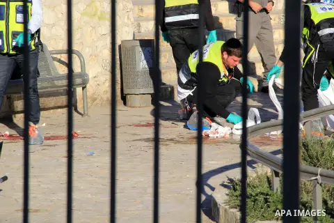 Ultra-Orthodox Jewish Zaka volunteers stand next to the blood-stained equipment of an Israeli member of security forces following an attack by reported Palestinian assailants at Damascus Gate, a main entrance to Jerusale...