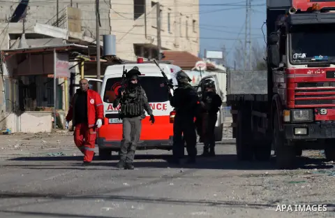 Israeli security forces take a position during clashes with Palestinian protesters in Qabatiya, a town near Jenin in the north of the Israeli-occupied West Bank, on February 4, 2016. Israeli forces locked down Qabatiya t...