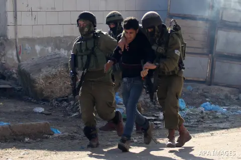 Israeli security forces detain a Palestinian protester during clashes in Qabatiya, a town near Jenin in the north of the Israeli-occupied West Bank, on February 4, 2016. Israeli forces locked down Qabatiya that was home...