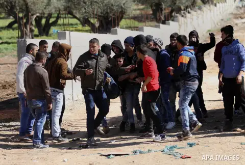 A wounded Palestinian is evacuated during clashes with Israeli security forces in Qabatiya, a town near Jenin in the north of the Israeli-occupied West Bank, on February 4, 2016. Israeli forces locked down Qabatiya that...